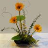 A table with flowers and plants in it